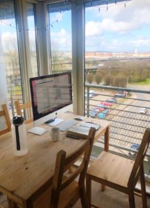 Photograph of Apple Mac on table - working from home